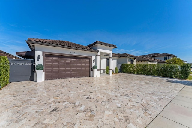 mediterranean / spanish-style house featuring a garage