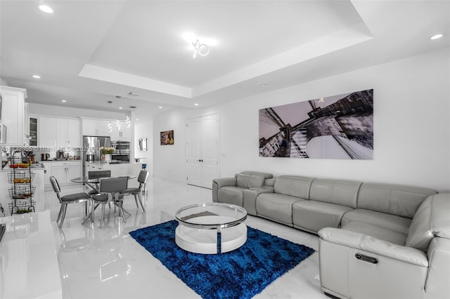 living room featuring a raised ceiling