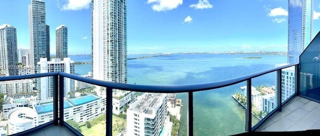 balcony featuring a water view