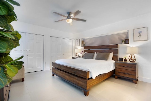 bedroom featuring ceiling fan and two closets