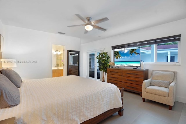 tiled bedroom with ceiling fan and ensuite bathroom