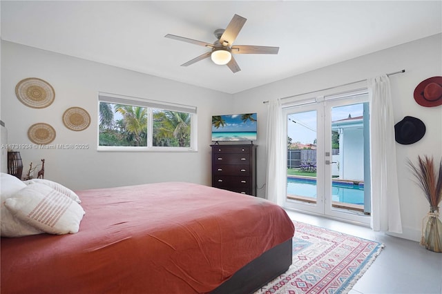 bedroom featuring french doors, ceiling fan, and access to outside