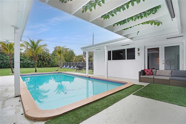 view of pool with an outdoor hangout area, a patio area, and a lawn