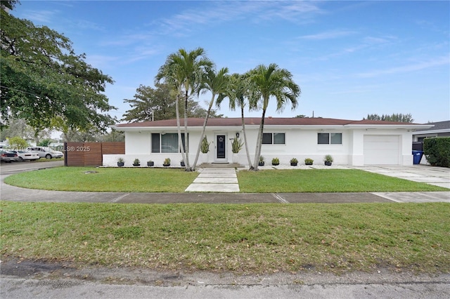 single story home with a garage and a front yard