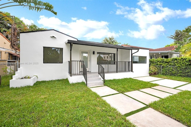 view of front of property with a front lawn and a porch