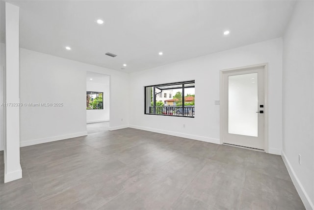 spare room featuring plenty of natural light