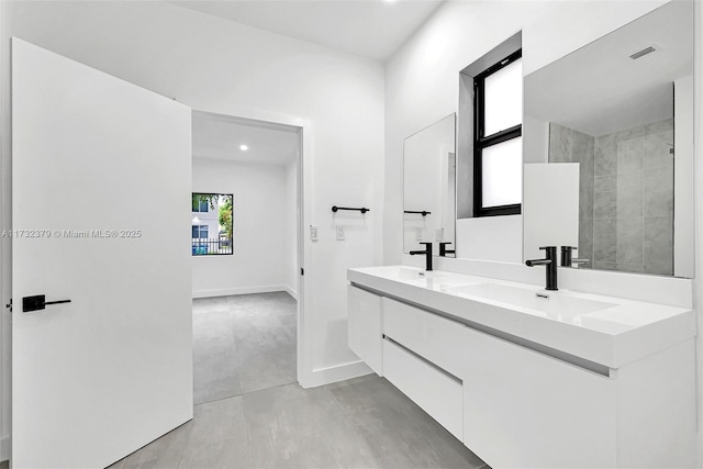 bathroom with vanity and walk in shower