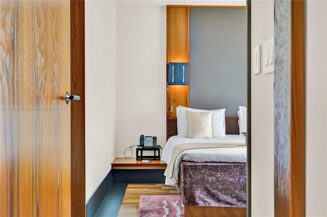 bedroom featuring dark hardwood / wood-style floors and a closet