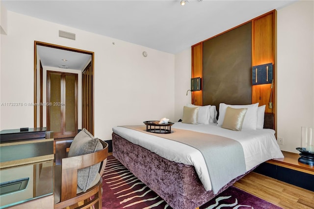 bedroom featuring hardwood / wood-style flooring