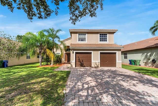 mediterranean / spanish home with a garage and a front yard