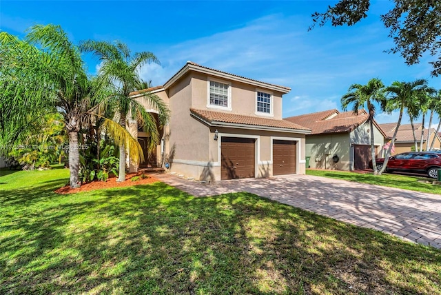 view of front of home with a garage and a front yard