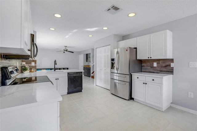 kitchen featuring tasteful backsplash, stainless steel appliances, sink, and white cabinets