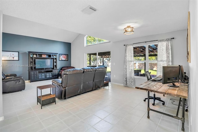 tiled living room with lofted ceiling and a textured ceiling