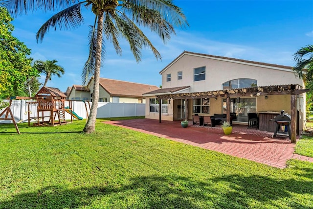 back of house featuring an outdoor bar, a pergola, a yard, a patio, and a playground