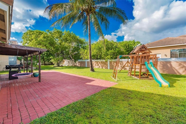 view of yard with a patio and a playground