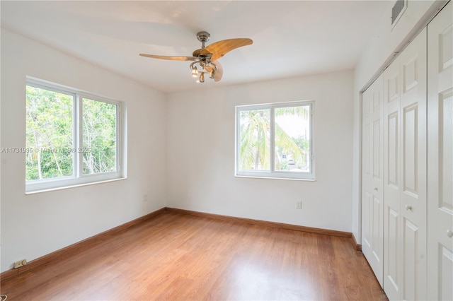 unfurnished bedroom with a closet, ceiling fan, and light hardwood / wood-style floors