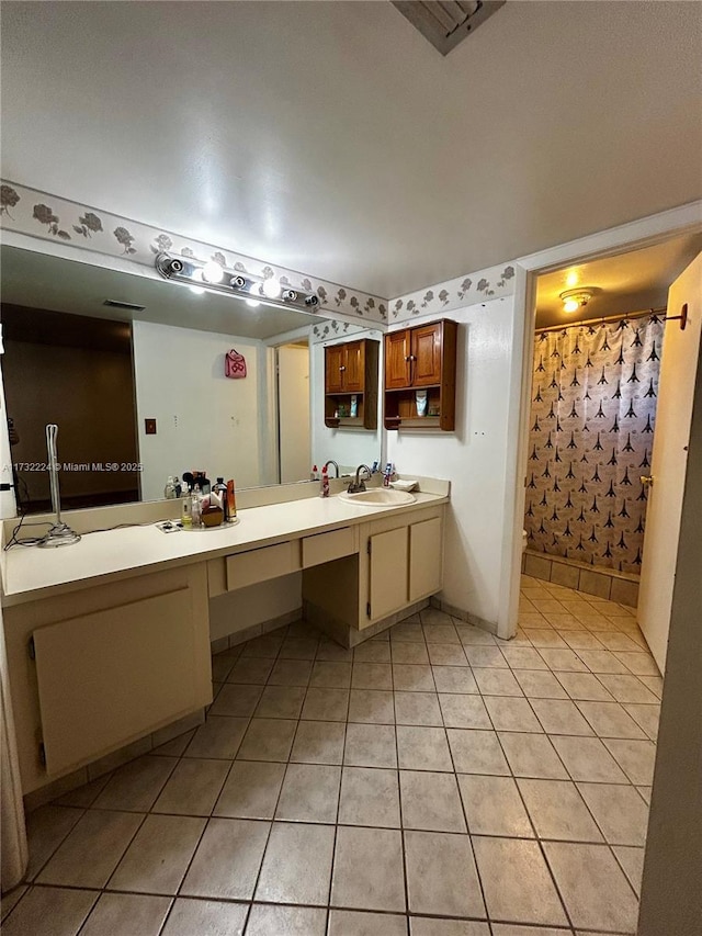 bathroom with tile patterned flooring, vanity, and a shower with curtain