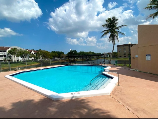 view of swimming pool featuring a patio