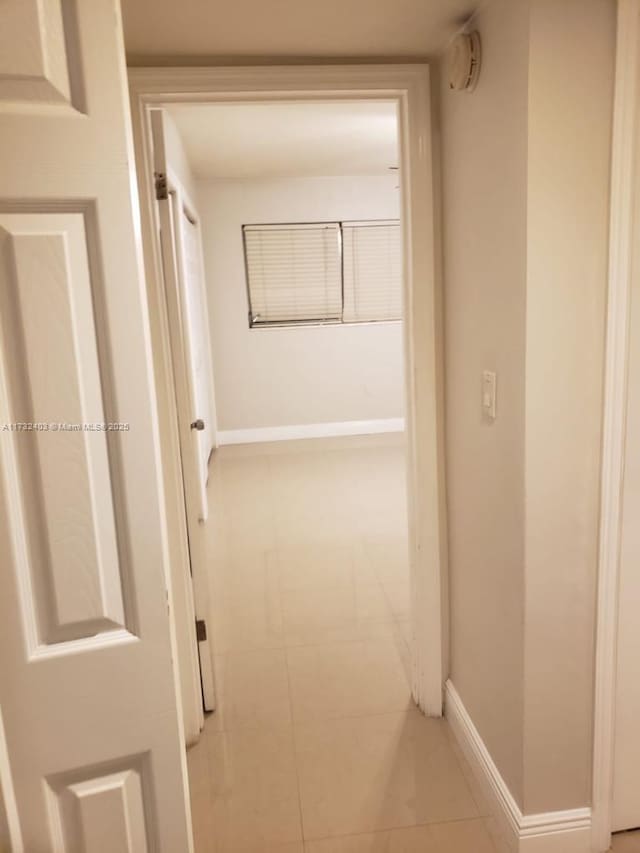 hallway with light tile patterned flooring