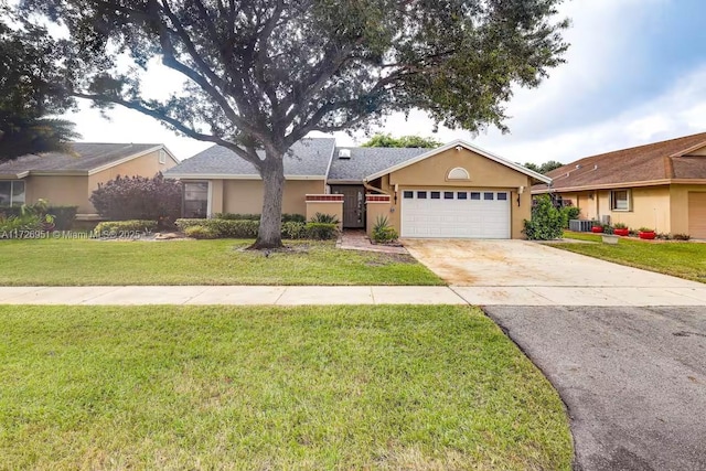 ranch-style house featuring a garage and a front lawn