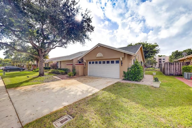 ranch-style house featuring a garage and a front yard