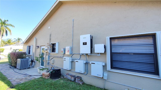 view of side of home featuring central AC