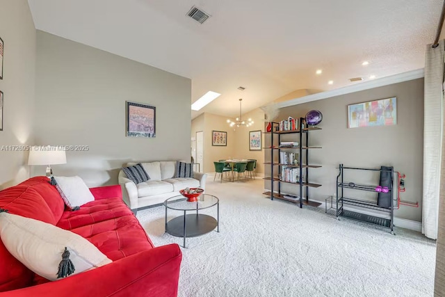 living room with an inviting chandelier, vaulted ceiling, and carpet flooring