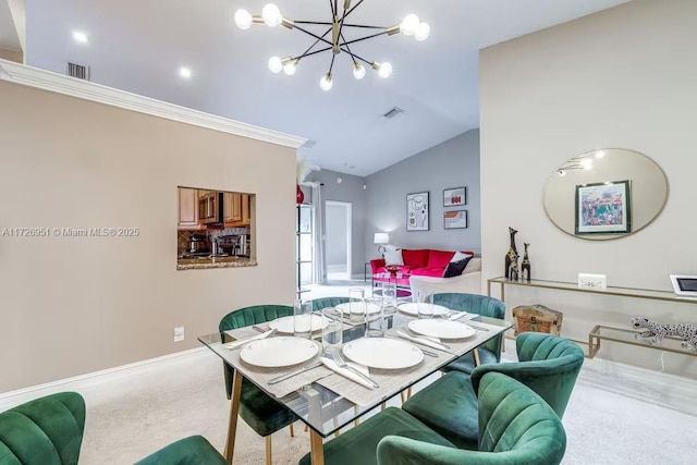 carpeted dining area featuring lofted ceiling