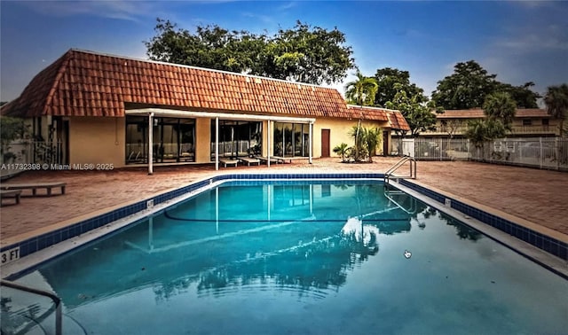 view of swimming pool featuring a patio