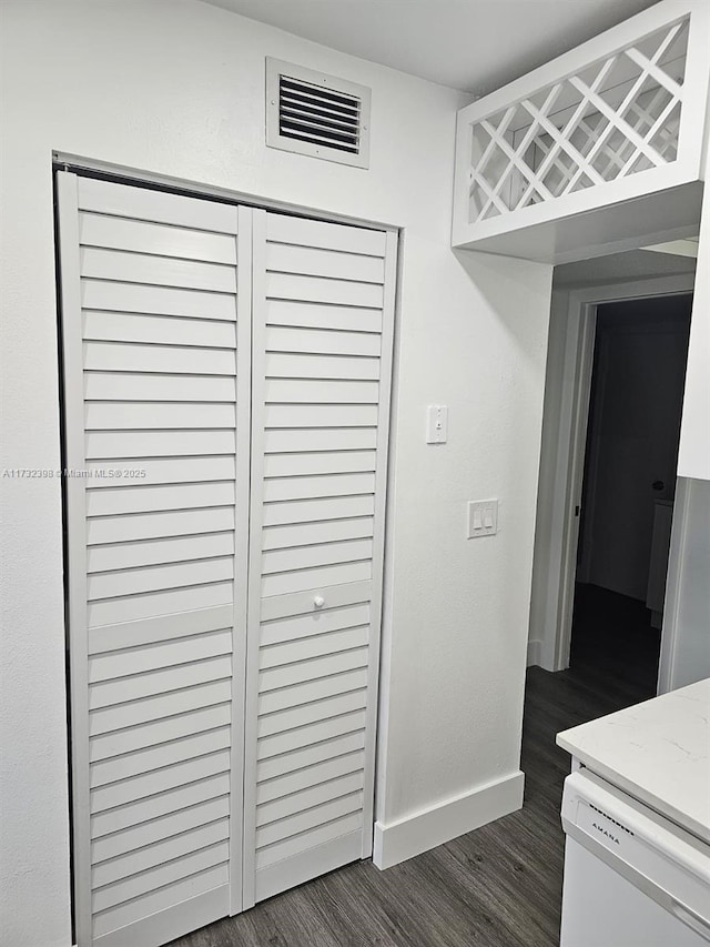 room details featuring wood-type flooring and dishwasher