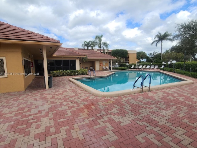 view of pool featuring a patio area