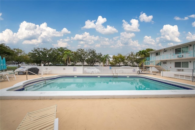 view of pool featuring a patio