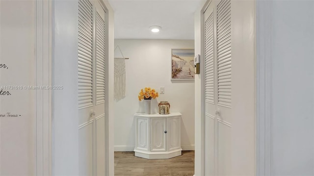 hallway with light wood-type flooring