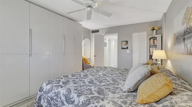 bedroom featuring ceiling fan and light hardwood / wood-style floors