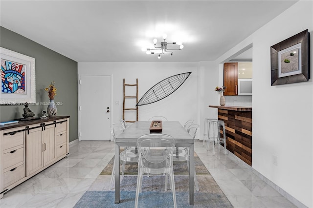 dining space featuring an inviting chandelier