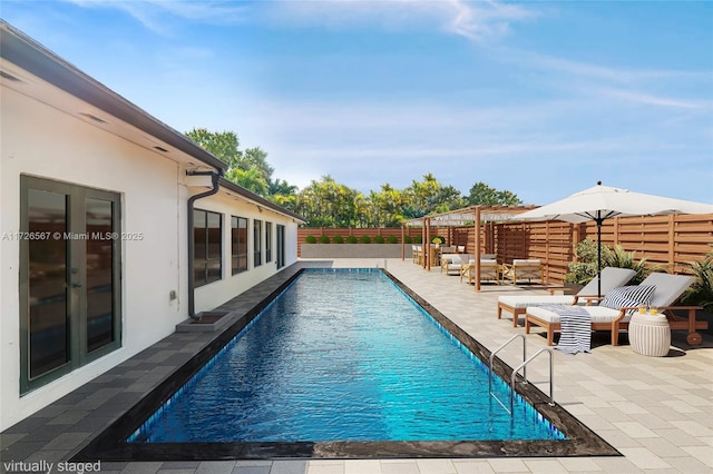 view of swimming pool featuring an outdoor living space and a patio