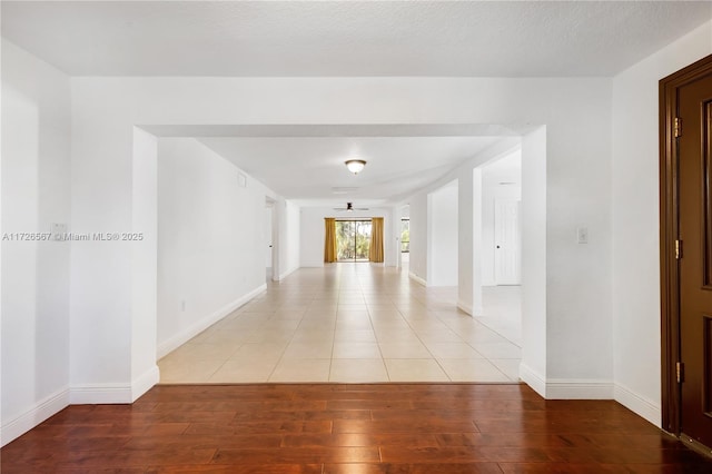 hall featuring hardwood / wood-style floors and a textured ceiling