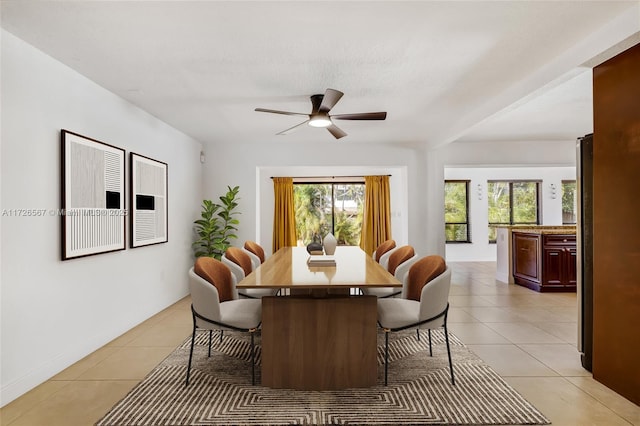 dining area featuring ceiling fan, plenty of natural light, and light tile patterned floors