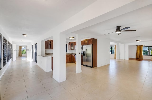 hall with light tile patterned floors