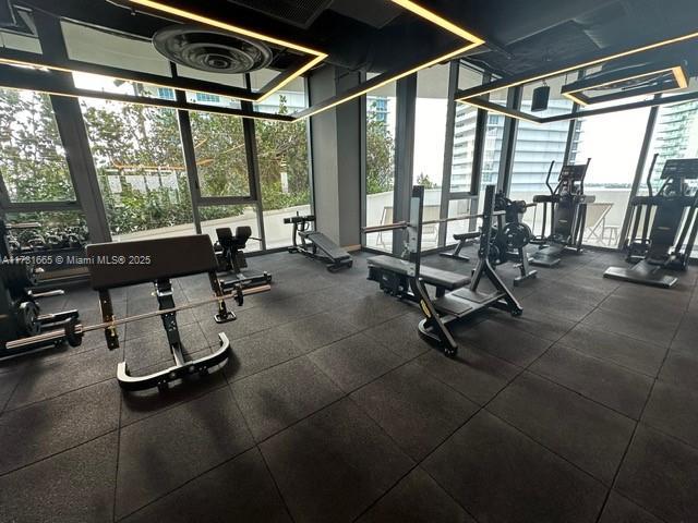 workout area with a wall of windows