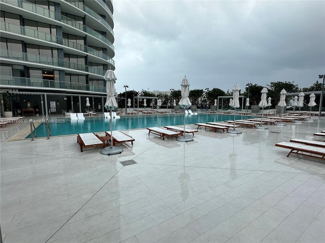 view of swimming pool featuring a patio area