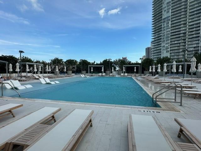 view of swimming pool featuring a patio area