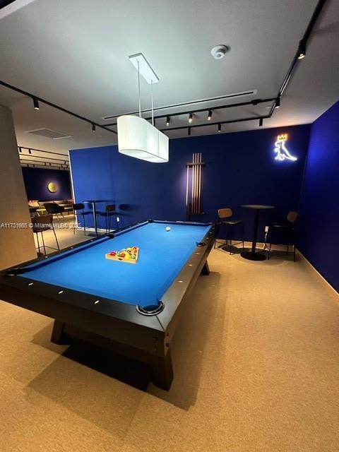 rec room with light colored carpet and pool table