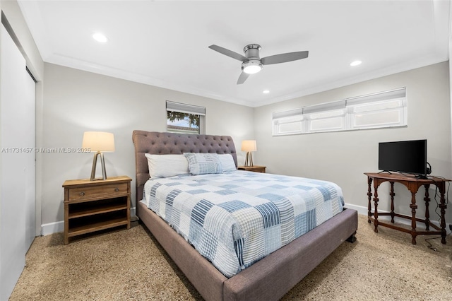 bedroom with crown molding, ceiling fan, and a closet