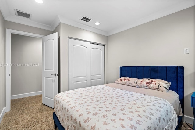 carpeted bedroom featuring crown molding and a closet