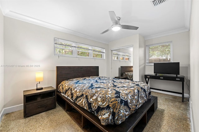 bedroom with ornamental molding and ceiling fan