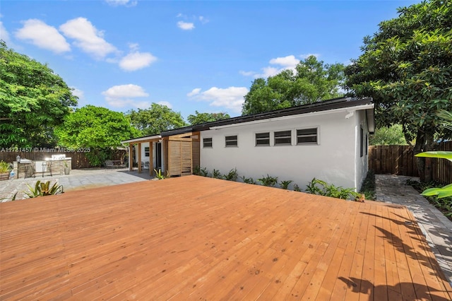 wooden deck featuring a patio