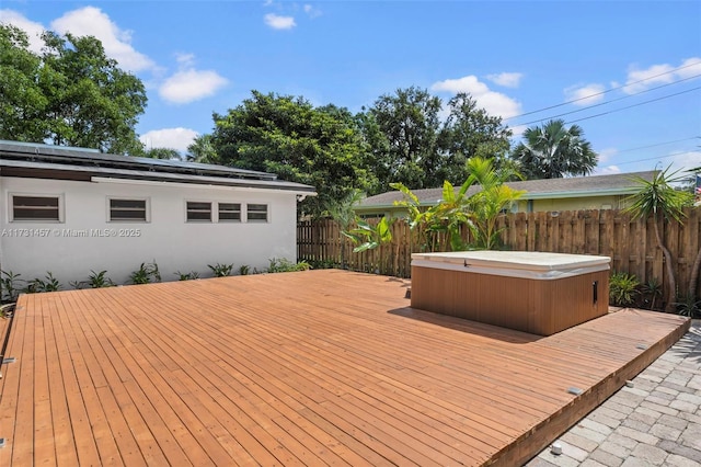 deck featuring a hot tub