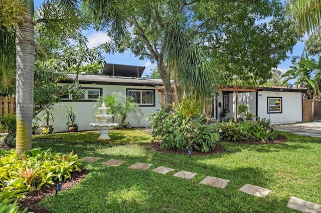 view of front of home with a front yard