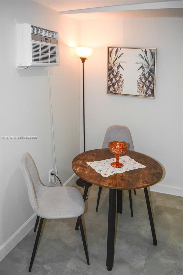 dining room featuring a wall mounted air conditioner